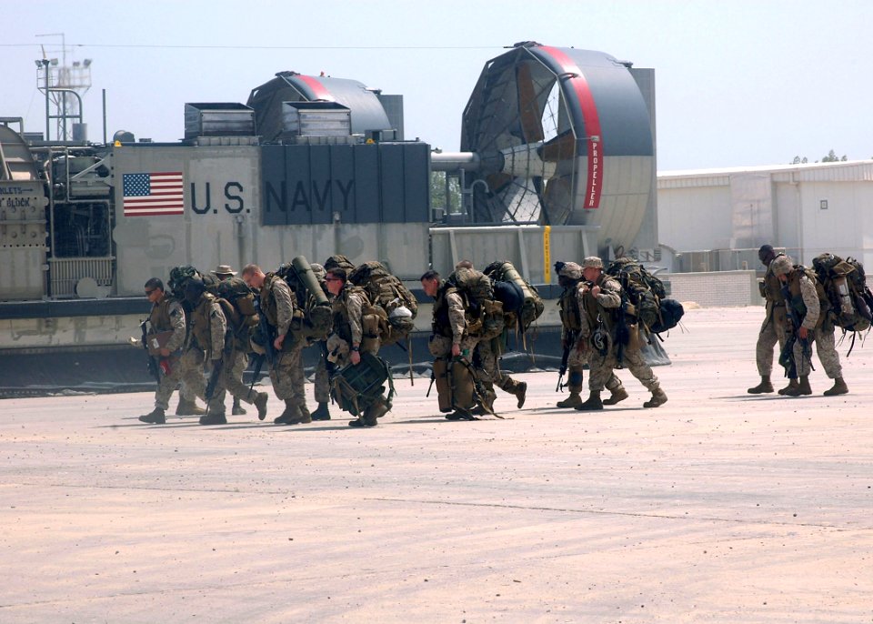 US Navy 070525-N-1226D-129 Marines assigned to the 13th Marine Expeditionary Unit (MEU) make their way into Kuwait Naval Base after disembarking a landing craft air cushion (LCAC) from USS Bonhomme Richard (LHD 6)