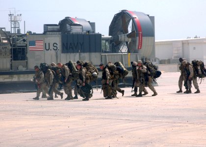 US Navy 070525-N-1226D-129 Marines assigned to the 13th Marine Expeditionary Unit (MEU) make their way into Kuwait Naval Base after disembarking a landing craft air cushion (LCAC) from USS Bonhomme Richard (LHD 6)
