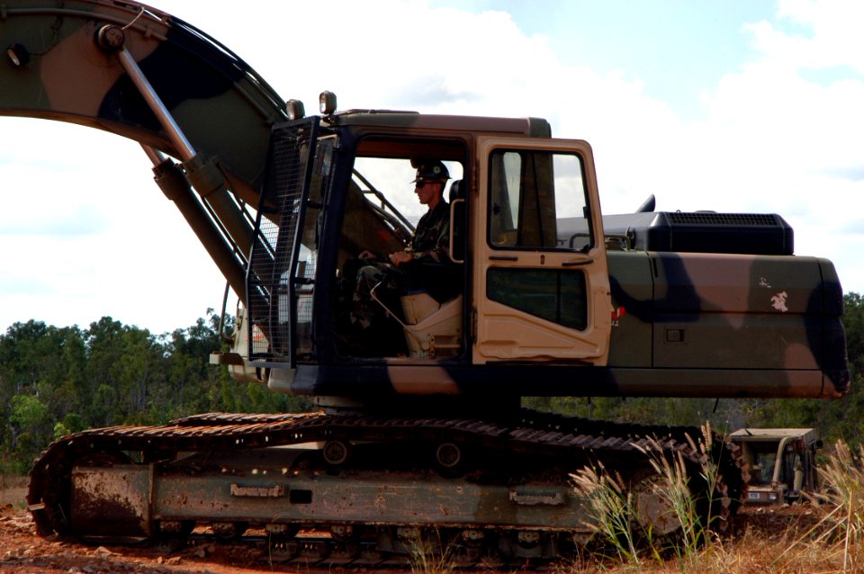 US Navy 070521-F-8678B-056 Equipment Operator Constructionman Apprentice Jeremy K. Baker operates an excavator during training at Robertson Barracks Driver Training Area