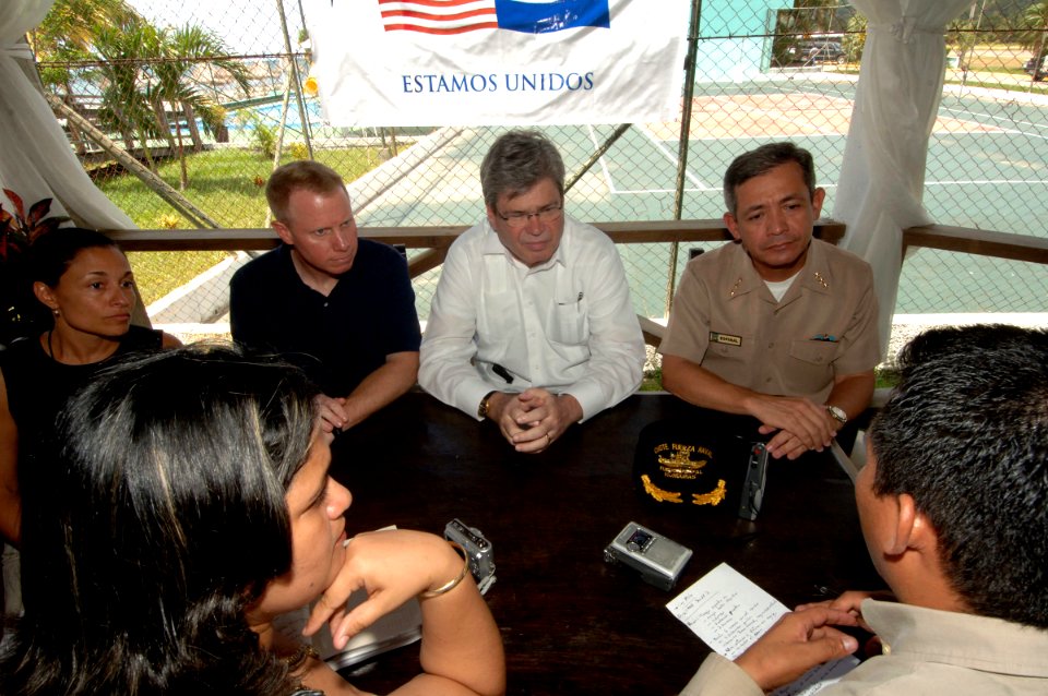 US Navy 070526-N-0989H-126 Capt Douglas Wied, Commander, Task Group 40.9 briefs the Honorable Charles A. Ford, U.S. Ambassador to Honduras, and other embassy staff on the mission of Task Group 40.9 during their deployment to th