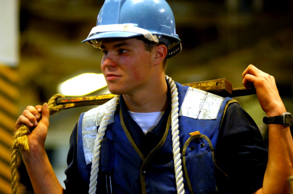 US Navy 070521-N-2984R-001 Seaman Victor Mickel prepares to work using a dogging wrench while on board amphibious assault ship USS Wasp (LHD 1)