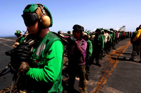 US Navy 070522-N-3729H-120 Flight deck personnel stow the aircraft barricade after flight deck drills on the flight deck aboard the Nimitz-class aircraft carrier USS John C. Stennis (CVN 74)