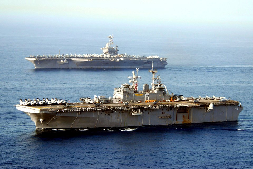 US Navy 070522-N-8157C-193 USS John C. Stennis (CVN 74) (top) and USS Bonhomme Richard (LHD 6) transit through the Gulf of Oman