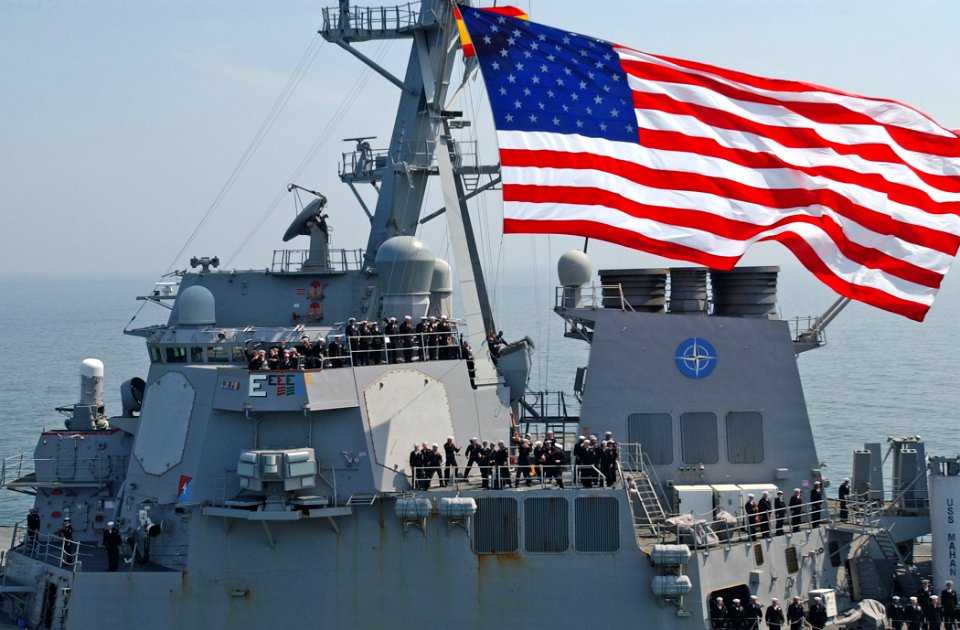 US Navy 070528-N-5459S-007 Sailors assigned to the guided-missile destroyer USS Mahan (DDG 72) man the rails and wave to guided-missile cruiser USS Normandy (CG 60) during a Sail Pass in the Baltic Sea