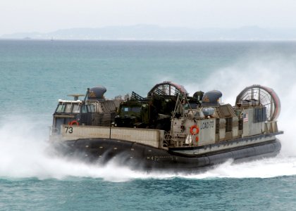 US Navy 070522-N-5067K-027 A landing craft air cushion (LCAC) from Assault Craft Unit (ACU) 5 approaches the well deck of amphibious transport dock USS Juneau (LPD 10)