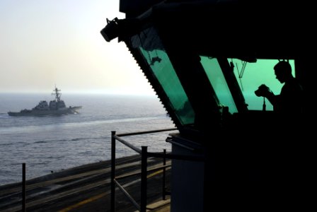 US Navy 070522-N-2659P-271 Guided-missile cruiser USS Antietam (CG 54) transits alongside Nimitz-class aircraft carrier USS John C. Stennis (CVN 74) during an exercise in the Gulf of Oman photo