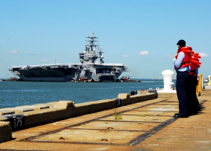 US Navy 070523-N-7241L-087 Sailors assigned to aircraft carrier USS Dwight D. Eisenhower (CVN 69) return to Naval Station Norfolk after the longest deployment by a carrier strike group since 2003