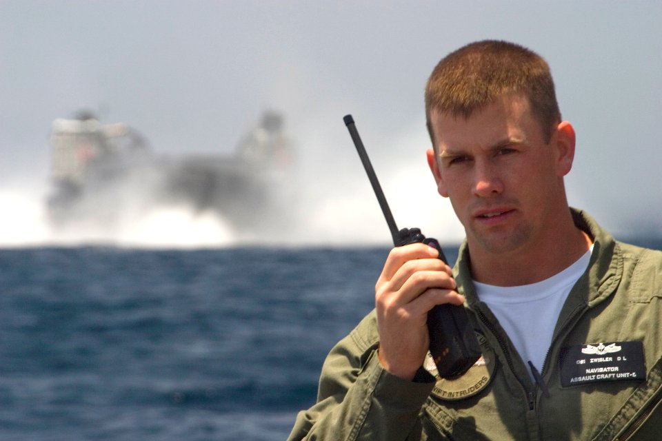 US Navy 070523-N-9150R-001 Operations Specialist 1st Class Daniel Zwisler, assigned to Assault Craft Unit (ACU) 5, coordinates maneuvers for two landing craft air cushion (LCAC) hovercrafts off the coast of Camp Pendleton