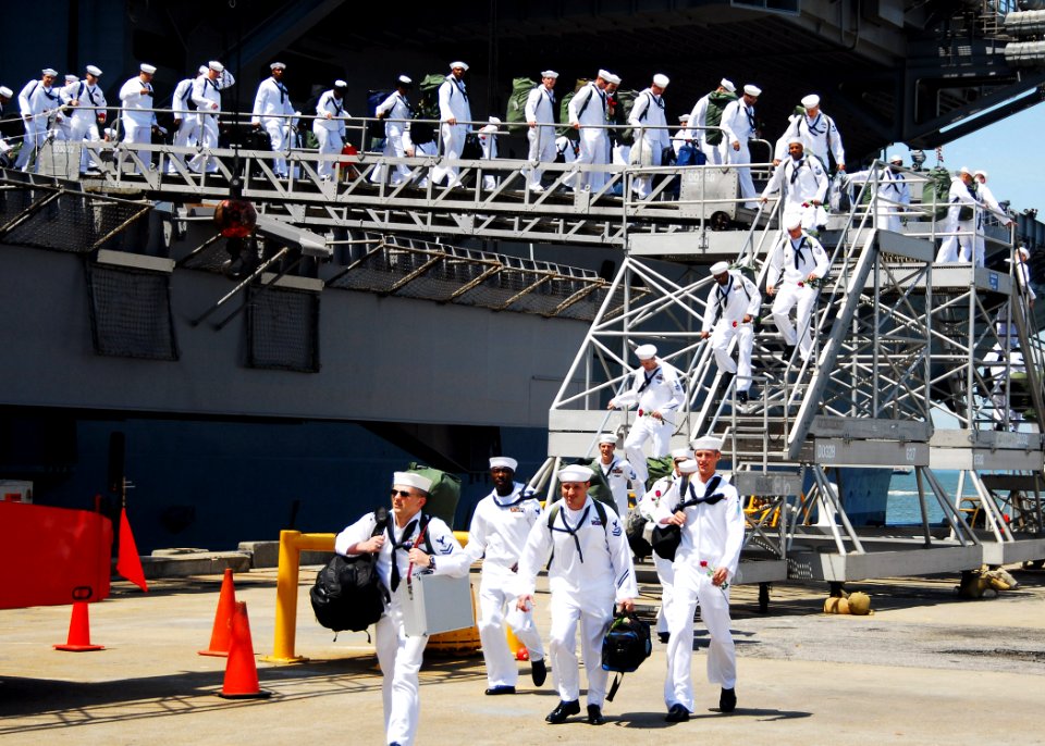 US Navy 070523-N-7241L-194 Sailors assigned to aircraft carrier USS Dwight D. Eisenhower (CVN 69) return to Naval Station Norfolk after the longest deployment by a carrier strike group since 2003