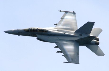 US Navy 070602-N-5345W-297 Water vapor flows over the wings of an F-A-18F Super Hornet