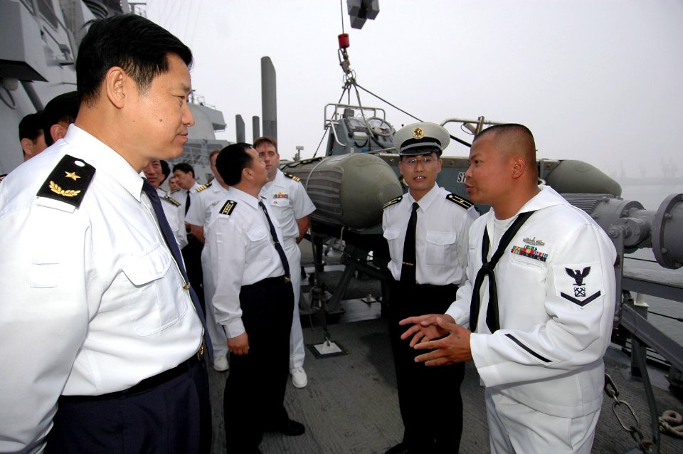 US Navy 070523-N-7883G-029 USS Stethem (DDG 63) Boatswain's Mate 3rd Class Allen Solis of San Diego, explains aspects of his job to Chinese North Sea Fleet Chief of Staff Rear Adm. Yongqing Zhao and his staff from the People's