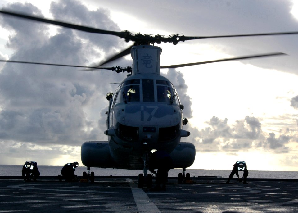 US Navy 070601-N-6710M-013 A CH-46 Sea Knight lands on the flight deck of USS Tortuga (LSD 46) during deck landing qualifications as the ship transits through Pioneer Channel