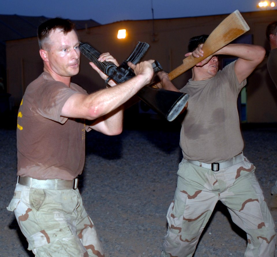 US Navy 070602-N-1003P-022 Senior Chief Construction Electrician John Smith assigned to Camp Lemonier Public Works Department, works on perfecting a self defense technique during the Marine Corps Martial Arts Program