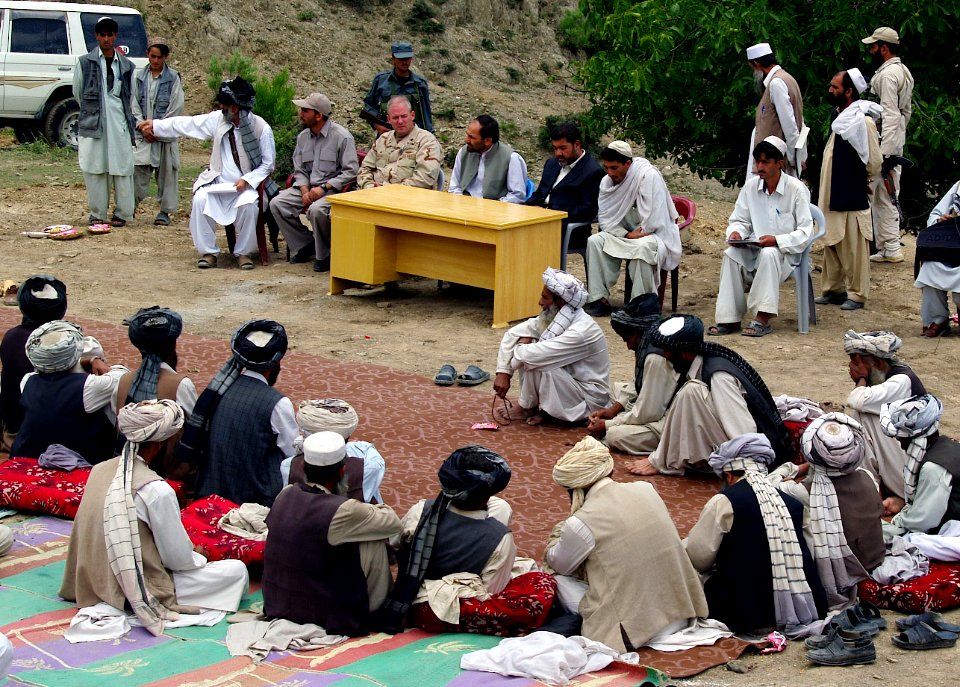 US Navy 070603-N-3385W-001 Commander of Khost Provincial Reconstruction Team, U.S. Navy Cmdr. Dave Adams, along with the provincial governor, take part in a groundbreaking of a district center for Qalandar