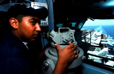 US Navy 070523-N-9928E-022 Seaman Alejandro Lopez stands lookout watch on the bridge during a transit through the Straits of Hormuz aboard the Nimitz-class aircraft carrier USS John C. Stennis (CVN 74) photo