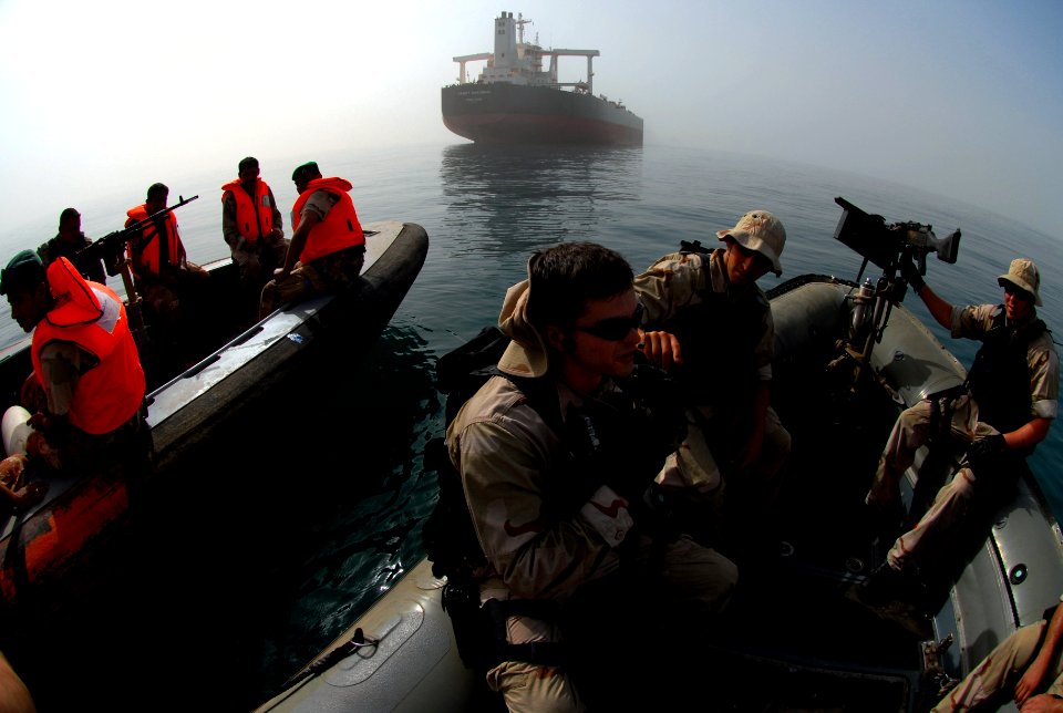 US Navy 070603-N-0684R-310 Visit, board, search and seizure (VBSS) team members, assigned to guided-missile destroyer USS Preble (DDG 88), and Iraqi forces wait for authorization before boarding an oil rig
