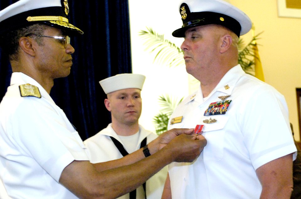US Navy 070530-N-8467N-002 Rear Adm. Cecil D. Haney pins the Bronze Star on Master Chief Aviation Ordnanceman Gary Mason, as Machinist's Mate 1st Class Caleb S. Duke looks on