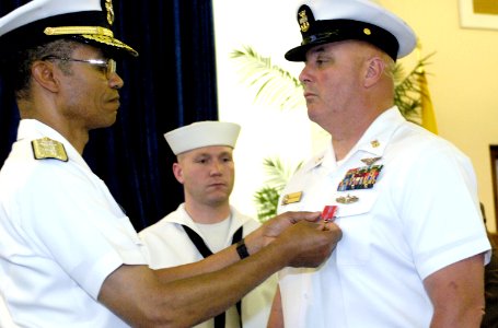 US Navy 070530-N-8467N-002 Rear Adm. Cecil D. Haney pins the Bronze Star on Master Chief Aviation Ordnanceman Gary Mason, as Machinist's Mate 1st Class Caleb S. Duke looks on