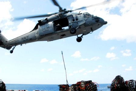 US Navy 070524-N-1831S-100 An MH-60S Seahawk, assigned to Helicopter Sea Combat (HSC) 22, drops supplies aboard amphibious assault ship USS Kearsarge (LHD 3)