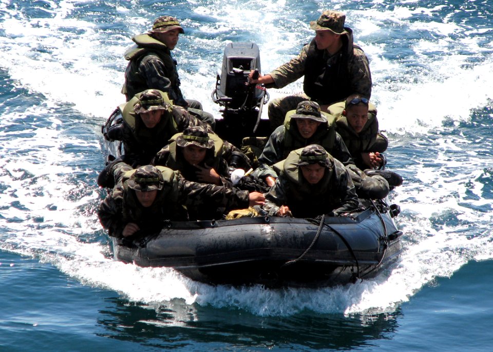 US Navy 070603-N-7058E-007 An assault boat carrying U.S. and Philippine Marines heads for the well deck of the dock landing ship USS Harpers Ferry (LSD 49)