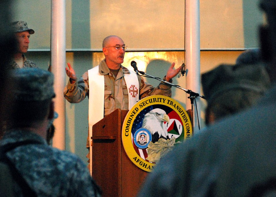 US Navy 070604-N-7415V-002 U.S. Navy Chaplain, Capt. Jim Fisher officiates at a Fallen Comrade Ceremony at Camp Eggers, Afghanistan