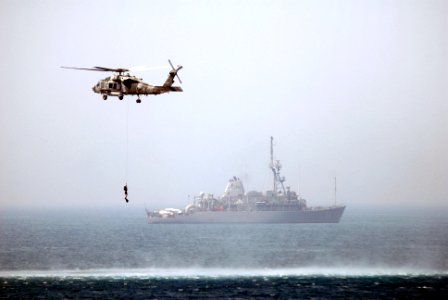 US Navy 070527-N-5484G-085 An SH-60F Seahawk helicopter, assigned to Helicopter Anti-Submarine Squadron (HS) 6, recovers one of its divers