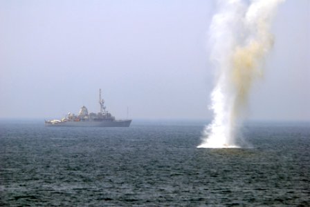 US Navy 070527-N-5484G-115 The Avenger-class mine countermeasure ship USS Scout (MCM 8) observes a simulated mine detonation