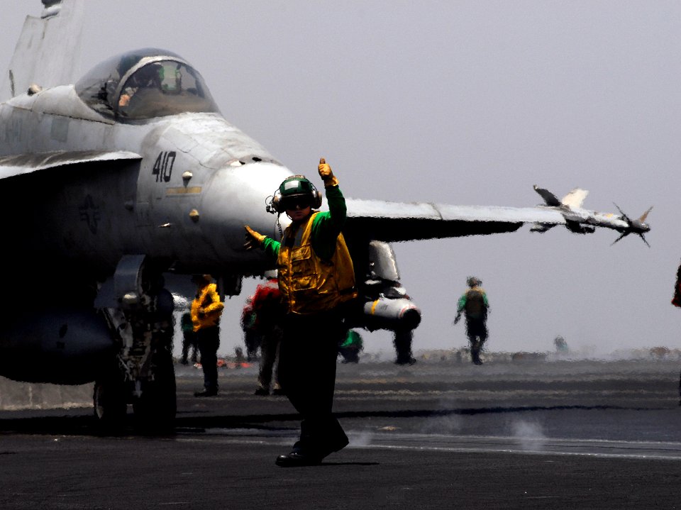 US Navy 070531-N-3038W-036 Catapult safety observer, Aviation Boatswain's Mate (Equipment) 1st Class Daniel Brandau, signals that an F-A-18C Hornet assigned to the Argonauts of Strike Fighter Squadron (VFA) 147 is ready for lau