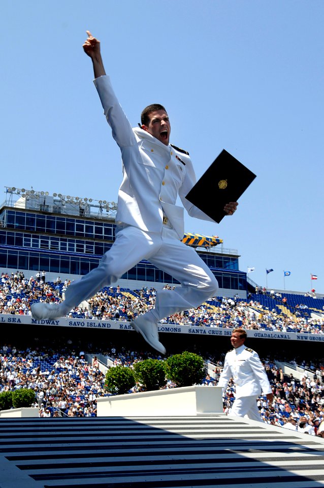 US Navy 070525-N-3642E-665 Newly commissioned Ens. Joshua Kristoff, celebrates after receiving his diploma