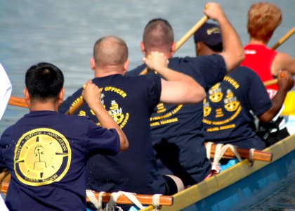 US Navy 070601-N-0879R-002 Members of the Naval Station Pearl Harbor Chief Petty Officers Association start their day paddling at the Rainbow Bay Marina in Pearl Harbor