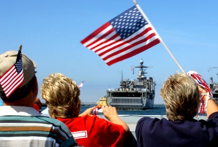 US Navy 070531-N-4163T-180 Family and friends cheer as the dock landing ship USS Comstock (LSD 45) pulls into port at Naval Base San Diego