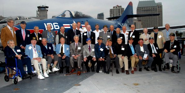 US Navy 070602-N-1722M-068 A group of the Battle of Midway survivors gather for a group photograph on the flight deck of the USS Midway Museum prior to the Victory at Midway Commemoration