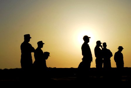 US Navy 070531-N-1688B-009 Members of the U.S. Navy Marksmanship Team (USNMT) listen as morning muster is called