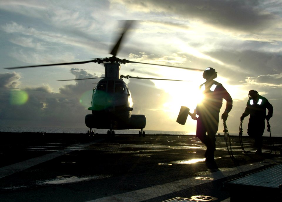 US Navy 070601-N-6710M-006 A CH-46 Sea Knight lands on the flight deck of USS Tortuga (LSD 46) during deck landing qualifications as the ship transits through Pioneer Channel