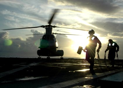 US Navy 070601-N-6710M-006 A CH-46 Sea Knight lands on the flight deck of USS Tortuga (LSD 46) during deck landing qualifications as the ship transits through Pioneer Channel