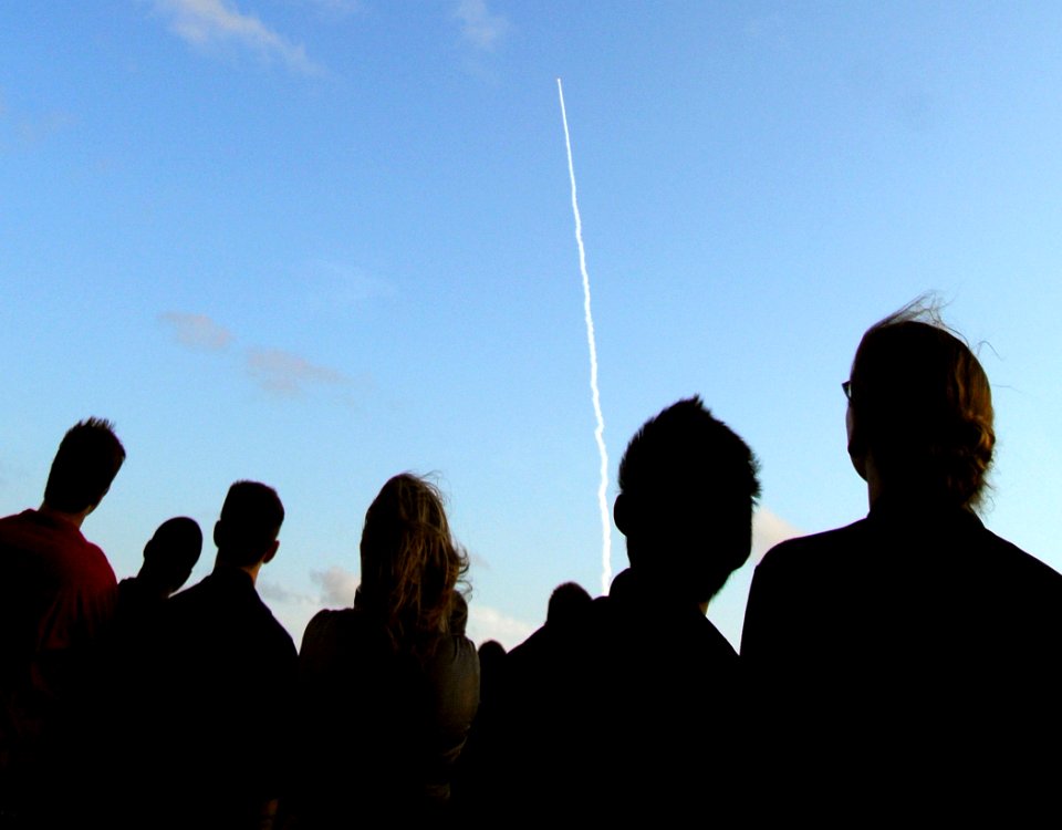 US Navy 070608-N-2984R-052 Sailors look on from the flight deck of the Nimitz-class aircraft carrier USS Harry S. Truman as the space shuttle Atlantis launches into space