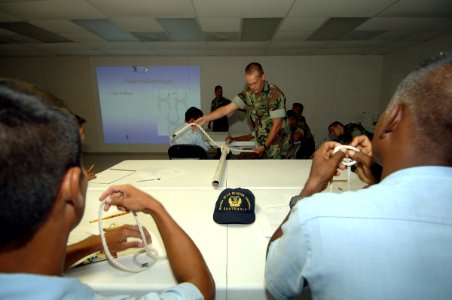 US Navy 070604-N-0989H-002 Guatemalan sailors and officer cadets practice tying knots during small boat operations subject matter exchanges aboard High Speed Vessel (HSV) 2 Swift