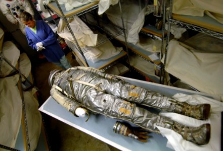 US Navy 070608-N-5345W-096 Amanda Young, the National Air ^ Space Museum's specialist in early manned spaceflight and astronautical equipment, dons her gloves while preparing to inspect former naval astronaut Rear Adm. Alan B