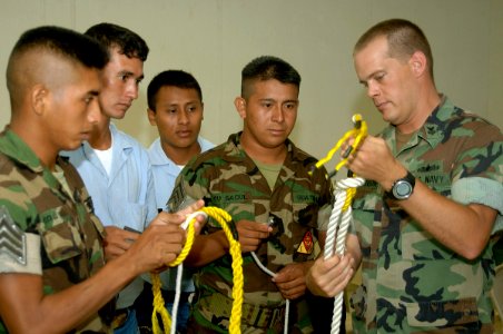 US Navy 070604-N-0989H-023 Guatemalan sailors and officer cadets practice tying knots during small boat operations subject matter exchanges on board High Speed Vessel (HSV) 2 Swift