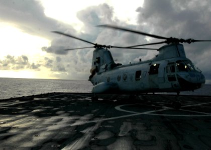 US Navy 070601-N-6710M-009 A CH-46 Sea Knight lands on the flight deck of USS Tortuga (LSD 46) during deck landing qualifications as the ship transits through Pioneer Channel