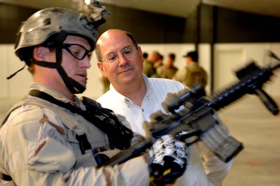 US Navy 070605-N-3642E-602 A U.S. Navy SEAL (Sea, Air, Land) shows the Secretary of the Navy (SECNAV) The Honorable Dr. Donald C. Winter a Special Operations Peculiar Modification (SOPMOD) M-4 at the Naval Amphibious Base Littl