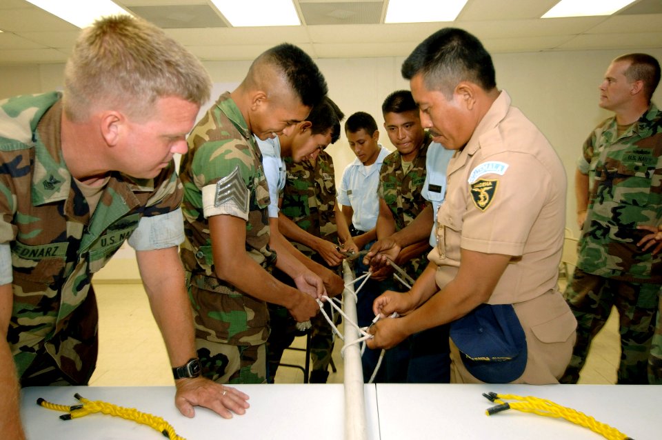US Navy 070604-N-0989H-041 Guatemalan sailors and 0fficer cadets practice tying knots during small boat operations subject matter exchanges on board High Speed Vessel (HSV) 2 Swift