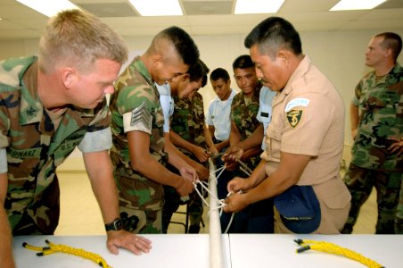 US Navy 070604-N-0989H-041 Guatemalan sailors and 0fficer cadets practice tying knots during small boat operations subject matter exchanges on board High Speed Vessel (HSV) 2 Swift photo