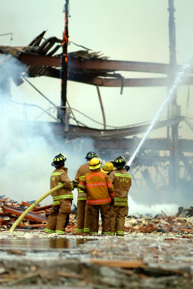 US Navy 070613-N-0411D-237 Firefighters work to extinguish a fire in Hangar One onboard Naval Air Station Brunswick