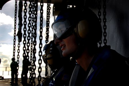 US Navy 070604-N-4790M-001 The flight deck crew stand by to chock and chain the SH-60F helicopters assigned to the Warlords of Helicopter Anti-Submarine Squadron Light (HSL) 51 aboard the amphibious Command ship USS Blue Ridge