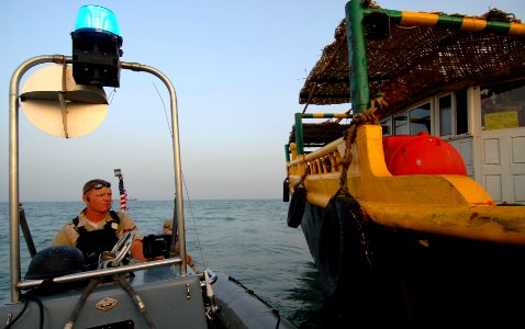 US Navy 070604-N-0684R-142 Seaman Kevin Bruton, from the visit, board, search and seizure (VBSS) team assigned to guided-missile destroyer USS Preble (DDG 88), prepares to pick up the rest of the VBSS team after they complete t