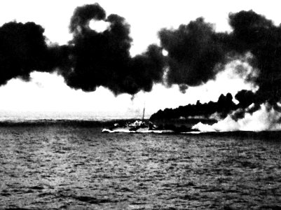 USS Dennis (DE-405) making smoke during the Battle off Samar on 25 October 1944 (80-G-287459)