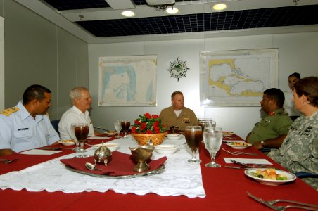 US Navy 070614-N-0989H-051 Commander, Task Group 40.9, Capt. Douglas Wied welcomes the Honorable Robert Dieter, U.S. Ambassador to Belize, aboard High Speed Vessel (HSV) 2 Swift during a tour and luncheon photo