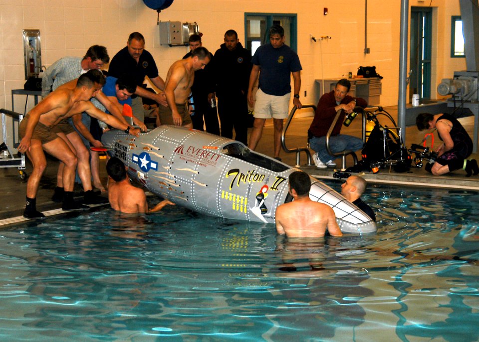 US Navy 070613-N-6247M-013 Sailors from Naval Air Station Whidbey Island's Aviation Survival Training Center (ASTC) and students from Everett Community College prepare to test a small submarine