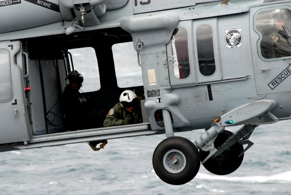 US Navy 070614-N-5033P-241 A SH-60 Seahawk helicopter departs the flight deck of amphibious assault ship USS Kearsarge (LHD 3) after dropping off a pallet of ammunition